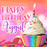 A vibrant birthday GIF featuring a rainbow-colored cupcake topped with white frosting, sprinkles, and a lit candle. The text reads 'Happy Birthday Aygül' in bold pink and violet letters with white outline.