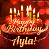 Beautifully decorated red velvet berry birthday cake with vibrant fruits and a glowing 'Ayla' name, adding a touch of sweetness and sparkle.