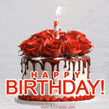 A chocolate-frosted cake topped with red roses and a single lit candle, with bold 'HAPPY BIRTHDAY!' text.