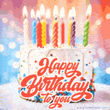 A white frosted cake with colorful sprinkles and lit candles, with vibrant 'Happy Birthday to you' text.