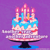 A colorful layered cake with lit candles and the text 'Another year, another adventure'.