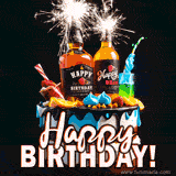A chocolate birthday cake with colorful candles surrounded by festive fireworks and a glowing ambiance.