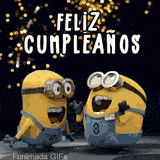 Una GIF animada que muestra a dos Minions en overol cantando con la boca abierta. El texto 'Feliz Cumpleaños' está arriba sobre un fondo oscuro con luces doradas que brillan.