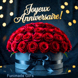 Animation montrant un luxueux bouquet de roses rouges dans un coffret sombre. L'inscription festive dorée flotte au-dessus des fleurs, entourée de lueurs bokeh chaleureuses.