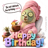 A funny llama relaxes in a pink bathrobe and towel turban with cucumber slices on its eyes, sipping a coconut cocktail under the text Do not disturb the birthday aura.