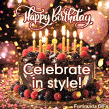 A chocolate birthday cake adorned with edible gold leaf, fresh raspberries, and blackberries sits under a shower of glittering foil rain and a maroon script.