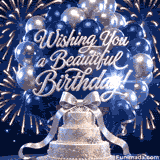 Cluster of navy blue and silver balloons floats above a white three tier cake with silver snowflake details and a large silver bow while elegant silver Wishing You a Beautiful Birthday lettering shines against fireworks