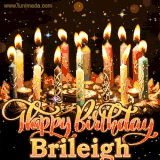 A glowing personalized birthday GIF with name Brileigh featuring lit candles with intricate designs, warm lighting, and the text 'Happy Birthday' in an elegant font.