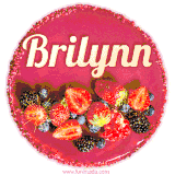 Beautifully decorated red velvet berry birthday cake with vibrant fruits and a glowing 'Brilynn' name, adding a touch of sweetness and sparkle.