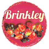 Beautifully decorated red velvet berry birthday cake with vibrant fruits and a glowing 'Brinkley' name, adding a touch of sweetness and sparkle.