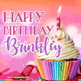 A vibrant birthday GIF featuring a rainbow-colored cupcake topped with white frosting, sprinkles, and a lit candle. The text reads 'Happy Birthday Brinkley' in bold pink and violet letters with white outline.