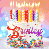 A cheerful white birthday cake with multicolor sprinkles, lit candles, and 'Brinley' written in vibrant letters, in an animated GIF.