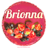 Beautifully decorated red velvet berry birthday cake with vibrant fruits and a glowing 'Brionna' name, adding a touch of sweetness and sparkle.