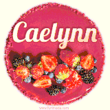 Beautifully decorated red velvet berry birthday cake with vibrant fruits and a glowing 'Caelynn' name, adding a touch of sweetness and sparkle.