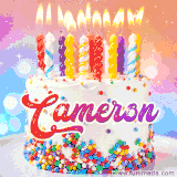 A cheerful white birthday cake with multicolor sprinkles, lit candles, and 'Cameron' written in vibrant letters, in an animated GIF.