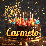 Shimmering golden particles around a chocolate frosted birthday cake with lit candles and the name Carmelo.