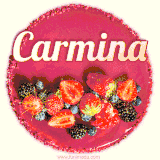 Beautifully decorated red velvet berry birthday cake with vibrant fruits and a glowing 'Carmina' name, adding a touch of sweetness and sparkle.