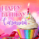 A vibrant birthday GIF featuring a rainbow-colored cupcake topped with white frosting, sprinkles, and a lit candle. The text reads 'Happy Birthday Carmina' in bold pink and violet letters with white outline.