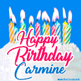A cheerful animated GIF featuring colorful lit birthday candles on a white cake, with the text 'Happy Birthday Carmine' in bold red and blue script on a bright blue background.