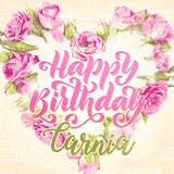 A stunning heart made of pink roses surrounds the elegant script text 'Happy Birthday Carnia' on a soft beige background. Animated sparkles add a magical and festive feel.