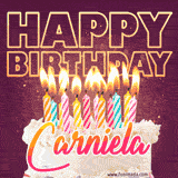A colorful birthday cake topped with lit candles, with the words 'Happy Birthday Carniela' in bold glowing letters on a burgundy background. Animated flames add a festive touch.