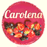 Beautifully decorated red velvet berry birthday cake with vibrant fruits and a glowing 'Carolena' name, adding a touch of sweetness and sparkle.