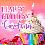 A vibrant birthday GIF featuring a rainbow-colored cupcake topped with white frosting, sprinkles, and a lit candle. The text reads 'Happy Birthday Carolena' in bold pink and violet letters with white outline.
