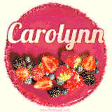 Beautifully decorated red velvet berry birthday cake with vibrant fruits and a glowing 'Carolynn' name, adding a touch of sweetness and sparkle.