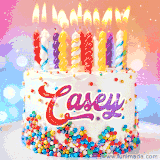 A cheerful white birthday cake with multicolor sprinkles, lit candles, and 'Casey' written in vibrant letters, in an animated GIF.