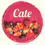 Beautifully decorated red velvet berry birthday cake with vibrant fruits and a glowing 'Cate' name, adding a touch of sweetness and sparkle.