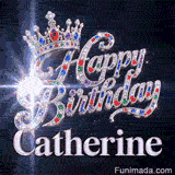 Close-up of a silver crown with emeralds, rubies, and sapphires resting on crystal-encrusted Happy Birthday text.Catherine