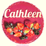 Beautifully decorated red velvet berry birthday cake with vibrant fruits and a glowing 'Cathleen' name, adding a touch of sweetness and sparkle.