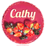 Beautifully decorated red velvet berry birthday cake with vibrant fruits and a glowing 'Cathy' name, adding a touch of sweetness and sparkle.