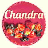 Beautifully decorated red velvet berry birthday cake with vibrant fruits and a glowing 'Chandra' name, adding a touch of sweetness and sparkle.
