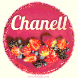 Beautifully decorated red velvet berry birthday cake with vibrant fruits and a glowing 'Chanell' name, adding a touch of sweetness and sparkle.