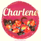 Beautifully decorated red velvet berry birthday cake with vibrant fruits and a glowing 'Charlene' name, adding a touch of sweetness and sparkle.