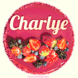 Beautifully decorated red velvet berry birthday cake with vibrant fruits and a glowing 'Charlye' name, adding a touch of sweetness and sparkle.