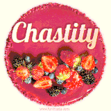Beautifully decorated red velvet berry birthday cake with vibrant fruits and a glowing 'Chastity' name, adding a touch of sweetness and sparkle.