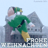 Eine riesige aufblasbare Elfenfigur, die Buddy ähnelt, weht im starken Wind fast waagerecht vor einem Haus. Darunter steht der Text 'FROHE WEIHNACHTEN' in großen Buchstaben.