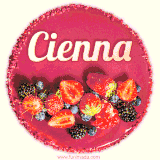 Beautifully decorated red velvet berry birthday cake with vibrant fruits and a glowing 'Cienna' name, adding a touch of sweetness and sparkle.