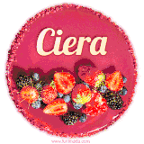 Beautifully decorated red velvet berry birthday cake with vibrant fruits and a glowing 'Ciera' name, adding a touch of sweetness and sparkle.