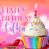 A vibrant birthday GIF featuring a rainbow-colored cupcake topped with white frosting, sprinkles, and a lit candle. The text reads 'Happy Birthday Cilka' in bold pink and violet letters with white outline.
