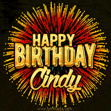 Golden 'Happy Birthday Cindy' text accompanied by animated rainbow fireworks for a festive animated greeting.