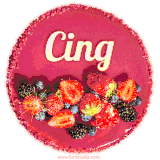 Beautifully decorated red velvet berry birthday cake with vibrant fruits and a glowing 'Cing' name, adding a touch of sweetness and sparkle.
