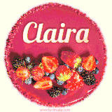 Beautifully decorated red velvet berry birthday cake with vibrant fruits and a glowing 'Claira' name, adding a touch of sweetness and sparkle.