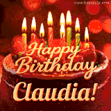 Beautifully decorated red velvet berry birthday cake with vibrant fruits and a glowing 'Claudia' name, adding a touch of sweetness and sparkle.