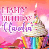 A vibrant birthday GIF featuring a rainbow-colored cupcake topped with white frosting, sprinkles, and a lit candle. The text reads 'Happy Birthday Claudia' in bold pink and violet letters with white outline.