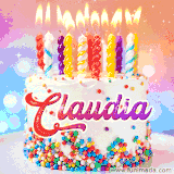 A cheerful white birthday cake with multicolor sprinkles, lit candles, and 'Claudia' written in vibrant letters, in an animated GIF.