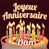 A Happy Birthday GIF in French featuring a festive birthday cake adorned with bright candles and the glowing text 'Joyeux Anniversaire Dan' in a cheerful style.