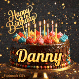 Multicolored frosting swirls and burning birthday candles on a chocolate cake with gold lettering spelling Danny.